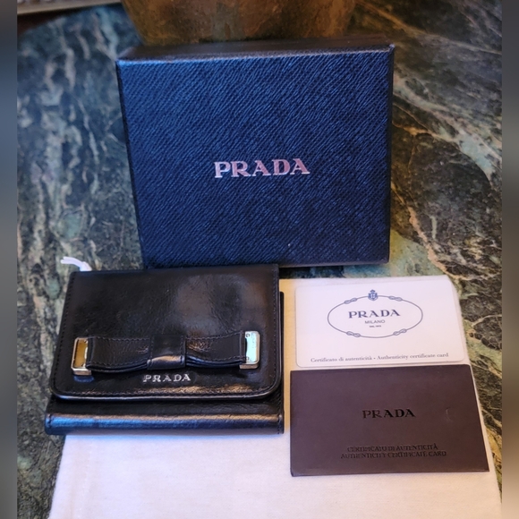 AUTHENTIC PRADA GLAZED BLACK CALF LEATHER TRI FOLD WALLET WITH BOW & SILVER LOGO - Picture 1 of 15